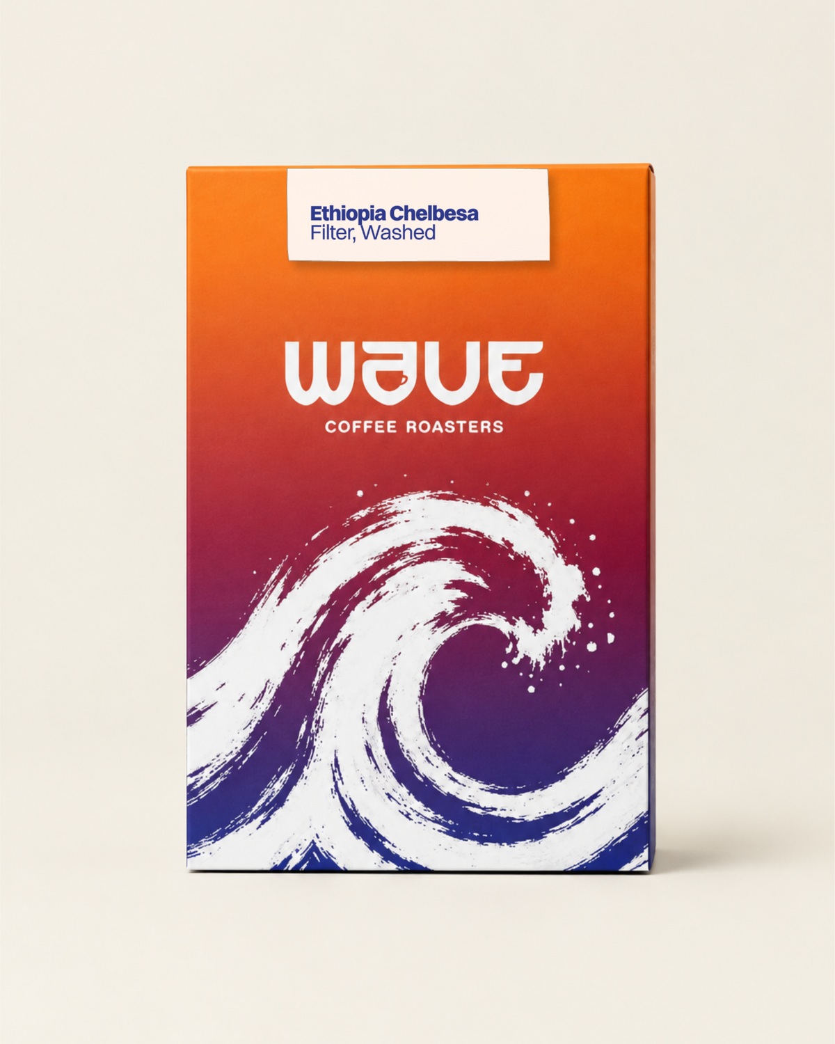 A rectangular coffee roaster box standing upright on a light beige background. The box has a bright orange-to-purple-to-blue gradient design with a large white wave illustration and the visible brand name 'wave coffee roasters' with specialty coffee label: 'Ethiopia Chelbesa Filter, Washed'