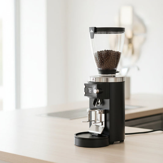 Coffee grinder with a clear container showing coffee beans on a white background