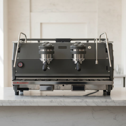 Commercial espresso machine with two spouts on a white background. La marzocco strada