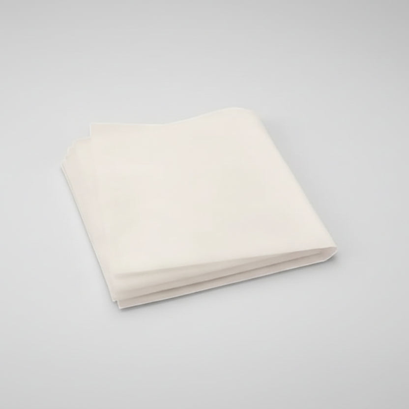 Folded white fabric on a white background